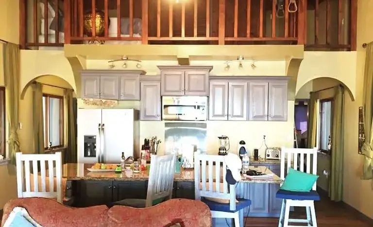 Living room, kitchen and loft of the house in Playa Vida, La Ceiba