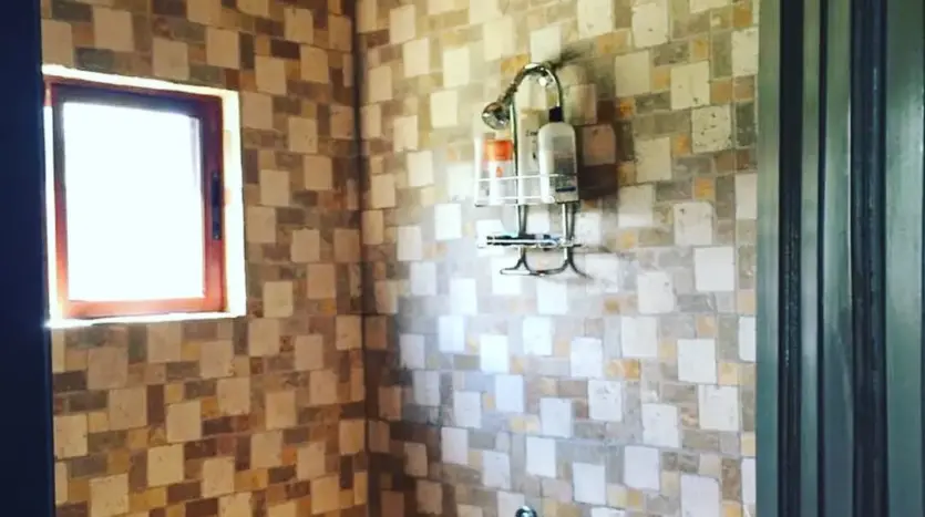 Tiled outdoor shower at the house in Playa Vida, La Ceiba