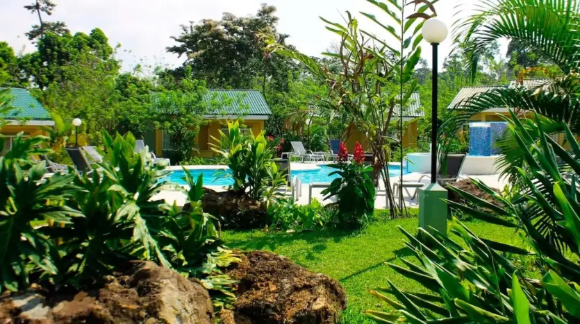 Tropical garden and pool at Corinto Pearl Eco Resort, La Ceiba
