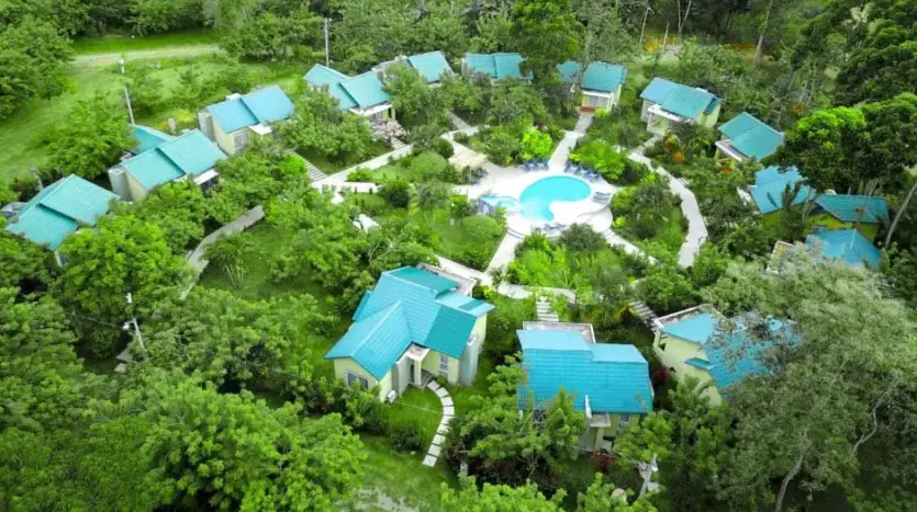 Aerial view of the bungalows and pool at Corinto Pearl, La Ceiba