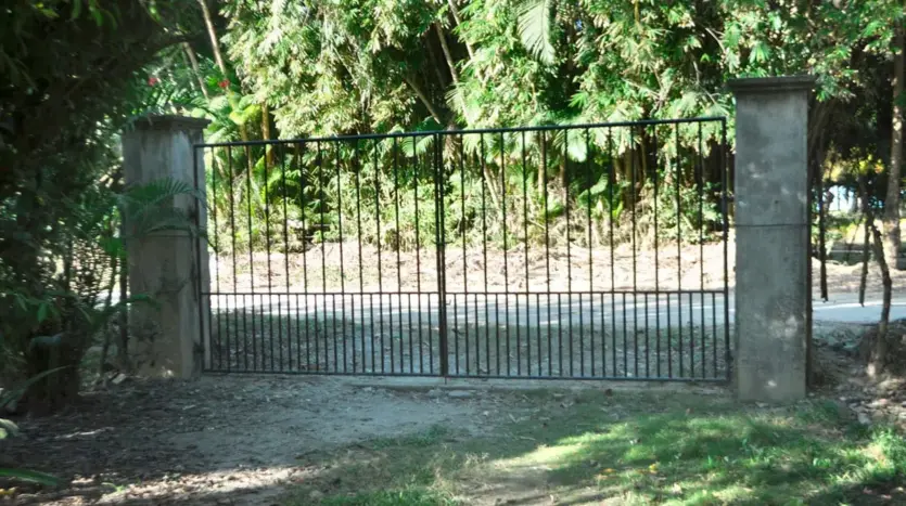 Gated entrance of the land in Tela Bay