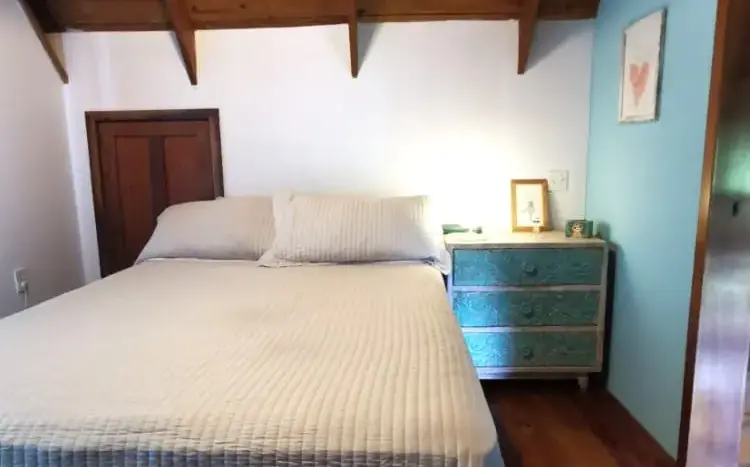 Bedroom with wood ceiling at Flamingo House, First Bight, Roatan