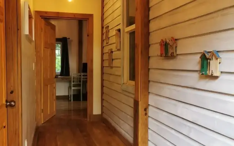 Hallway with wood floors at Flamingo House, First Bight, Roatan