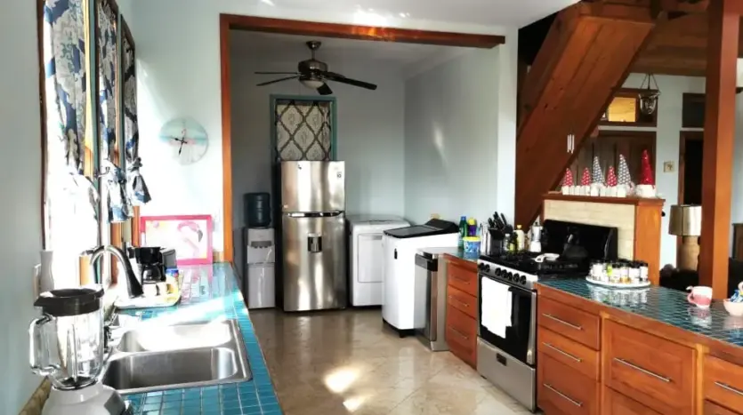 Kitchen with turquoise counters at Flamingo House, Roatan