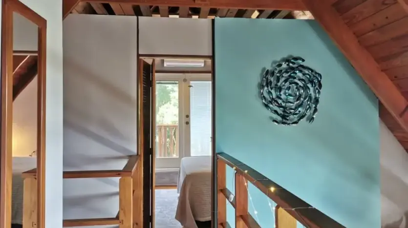Upstairs hallway with wood beams at Flamingo House, Roatan