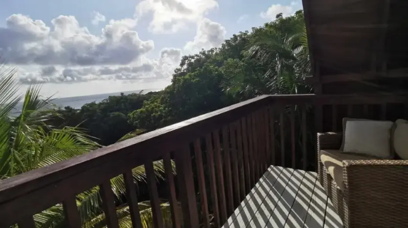 Balcony with ocean and forest view at Flamingo House, Roatan