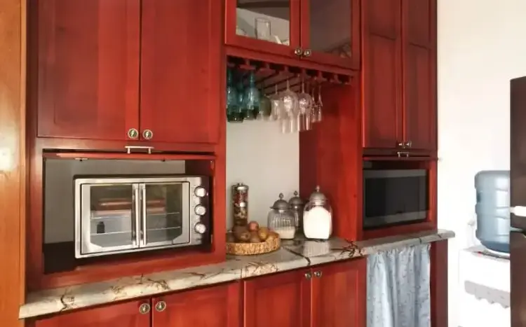 Kitchen with cherry wood cabinets at Flamingo House, Roatan