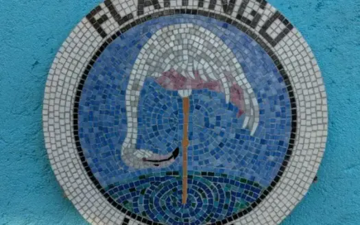 Flamingo House mosaic sign in First Bight, Roatan