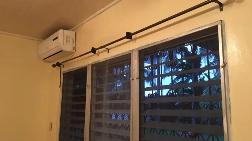 Room with barred windows in an apartment in Puerto Cortes