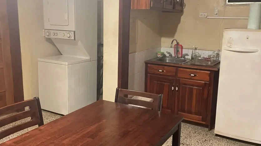 Dining area and kitchenette in an apartment in Puerto Cortes