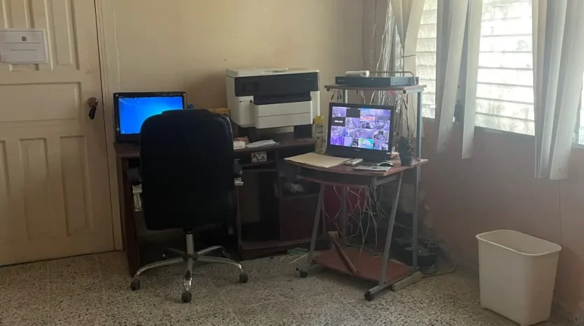 Office workspace with computers in Puerto Cortes