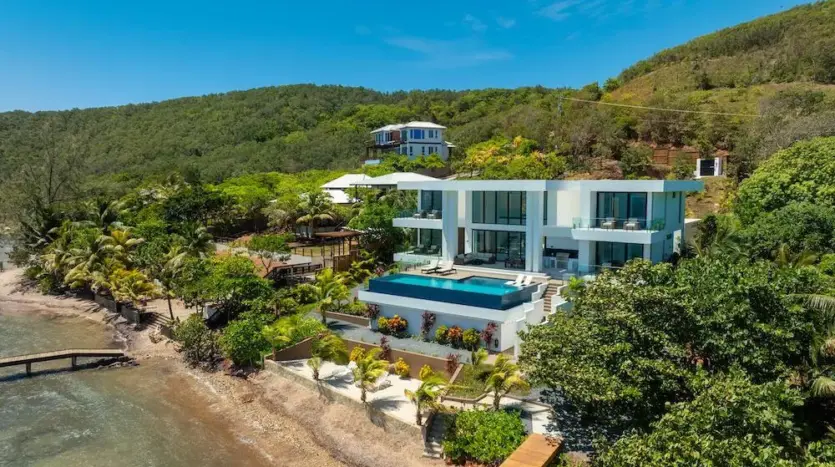 Villa, beach and private dock from above, Camp Bay