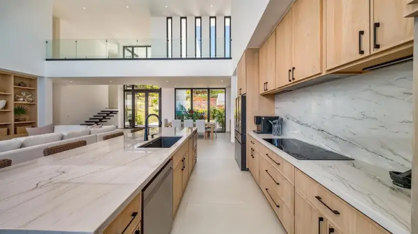 Kitchen with marble-look counters and wood cabinets