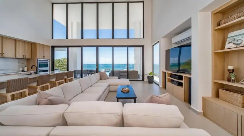 Double-height great room with glass walls