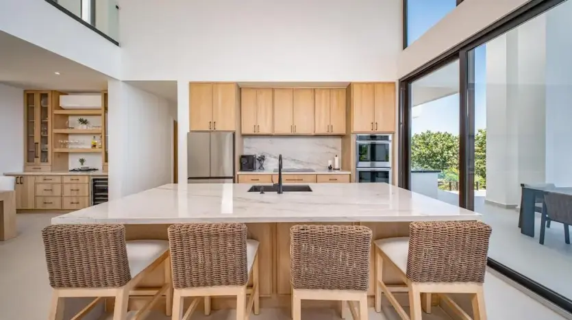 Kitchen with large island and bar stools