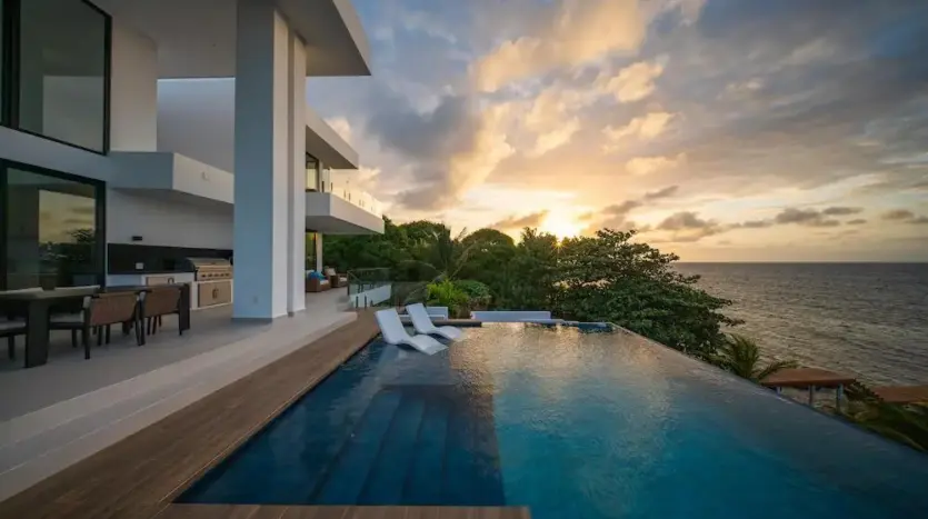 Infinity pool and terrace at sunset