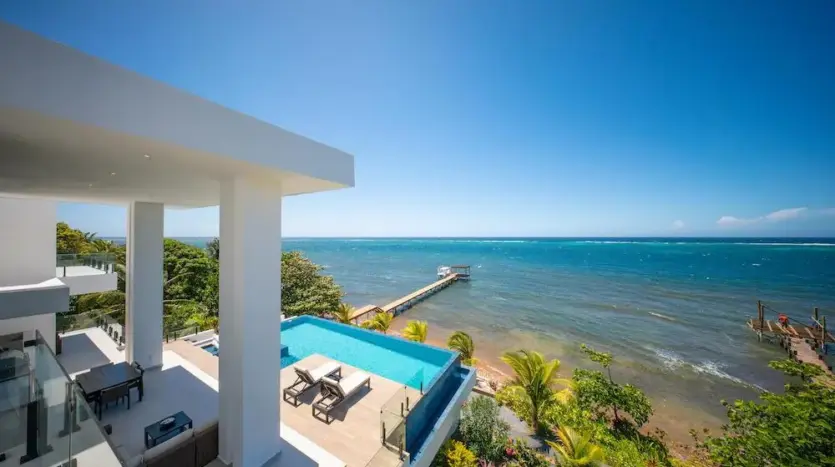 View over pool, beach and sea from the upper terrace