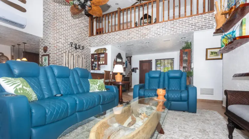 Double-height living room with loft above