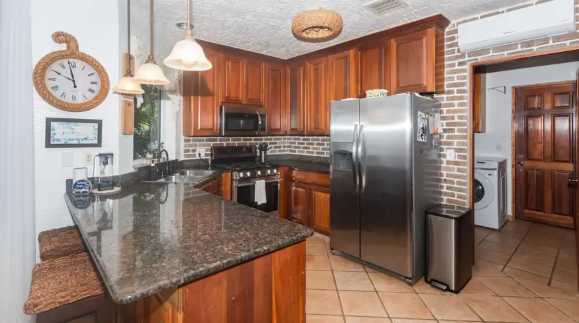 Kitchen with granite counters and steel appliances