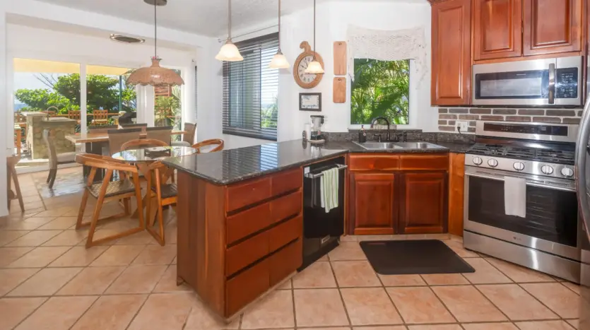 Kitchen with granite island and wood cabinets