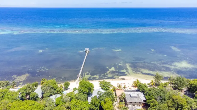 Seadancer beach cabana area seen from the air with dock and reef, Sandy Bay