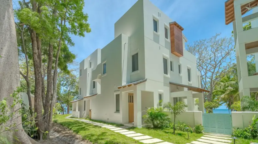 Condo building with tropical landscaping