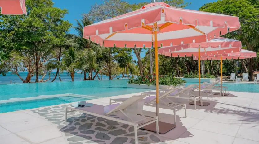Pool deck with loungers and umbrellas