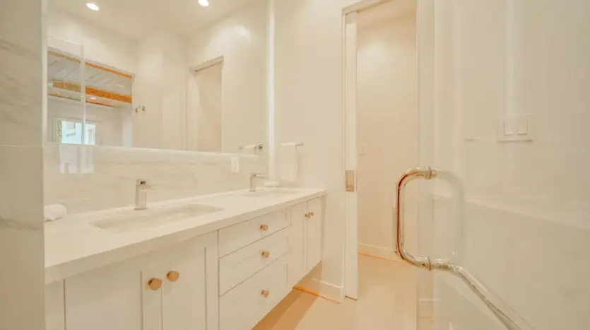 Primary bathroom with double vanity, sample unit