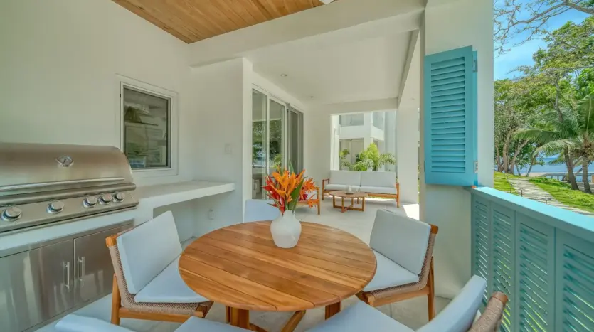 Terrace with dining table and built-in grill, sample unit